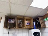 two wooden crates on the wall above a sink