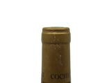 a bottle of wine that is sitting on a table