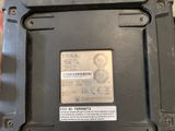 someone is holding a black box with a sticker on it