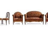 three chairs and a chair are sitting next to each other on a white surface