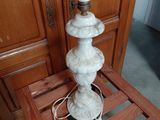 a lamp that is sitting on a small wooden table