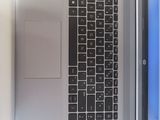 a laptop computer sitting on top of a desk next to a monitor