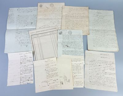 several old papers are stacked on top of each other on a table