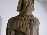 a wooden statue of a darth vader in a room