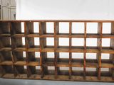 a wooden shelf that has a lot of shelves on it