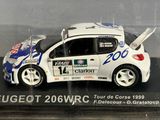 a white car with blue and white paint on it in a display case