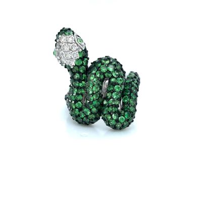an image of a close up of a snake ring with green and white stones