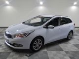 the white car is parked on a checkered floor in the garage