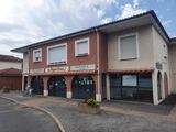 an image of a building with a sign on the front of it