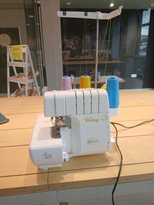 a sewing machine that is sitting on a wooden table