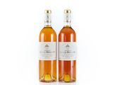 two bottles of wine sitting next to each other on a white surface