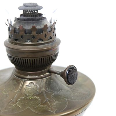 a metal lamp that is sitting on top of a table