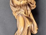an image of a statue of a woman holding a child
