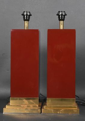 pair of red glass lamps with brass bases and black lampshads