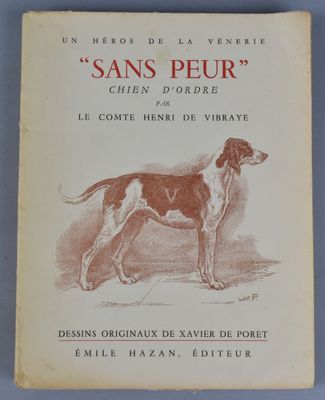 un vieux livre sur lequel figure le dessin d'un chien