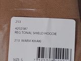 a label on the back of a brown shirt