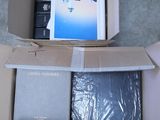 a box that has a laptop in it on the floor