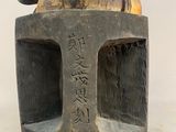 a statue of a man riding a horse on top of a stone block