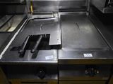 an image of a commercial kitchen with a lot of counter space