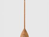 an image of a wooden instrument with a long neck and a wooden stick