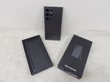 an image of a black box with a cell phone inside of it