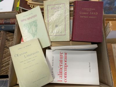 boxes of books are stacked on top of each other on a table