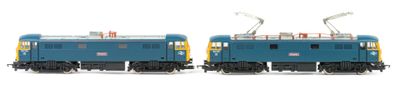 two blue trains sitting side by side on a white surface