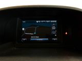 the dashboard of a car with a gps device in the center