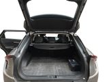 the back of a car with its trunk open and the back seats folded down