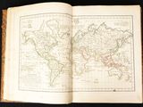 an open book with a map of the world on it