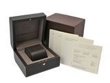 a watch in a box with a receipt in it