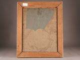 an old picture frame with a piece of paper in it on a table