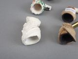 a lot of different types of pipes on the table