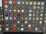 a lot of different colored buttons in a black case