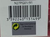 a close up of a bunch of red grapes with a barcode on it