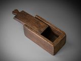 an image of a wooden box with a handle on a table