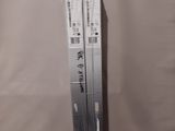 pair of nintendo wii game consoles in plastic wrap on a table
