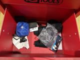 a red box with a bunch of items inside of it