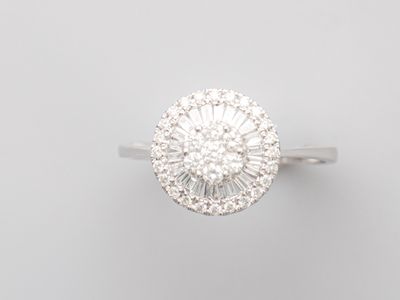 an 18k white gold diamond cluster ring