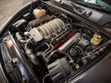 a car engine with the hood open in a garage