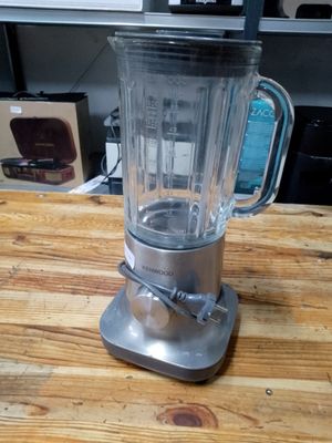 a blender that is sitting on a wooden table