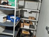 many boxes and boxes on the shelves in the room