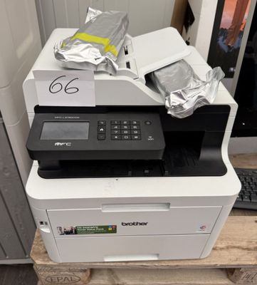 a printer that is sitting on top of a pallet