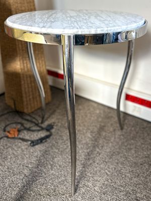 a close up of a table with a mirror on top of it