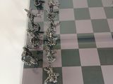 a chess board with a chess game set on top of it