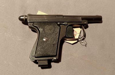 a gun that is laying on a table