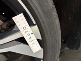 a close up of a tire with a measuring tape on it
