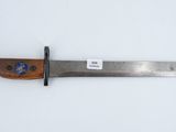 a close up of a knife with a wooden handle on a white surface