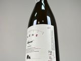 a bottle of wine that is sitting on a table
