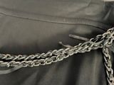 a chain that is attached to the back of a jacket